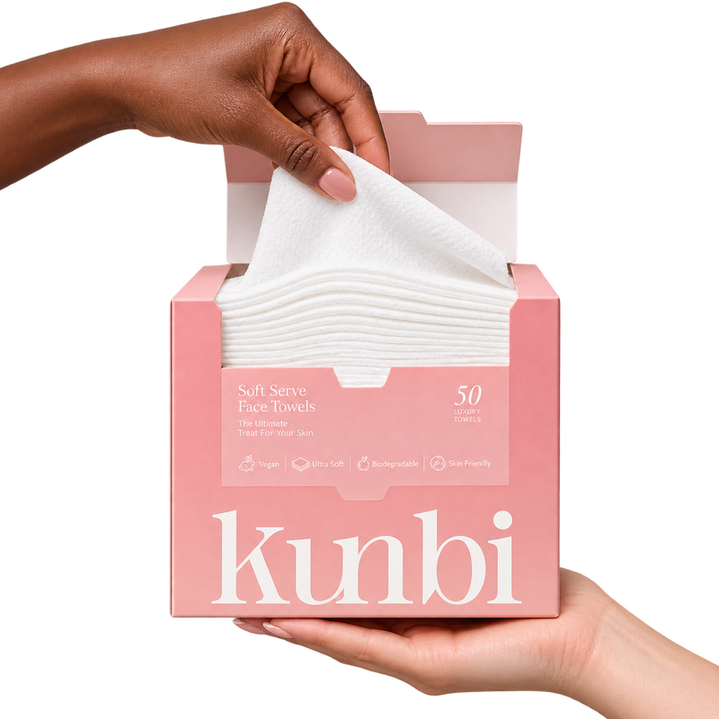 Kunbi Soft Serve Face Towels 50-pack held open by hand — real product photograph